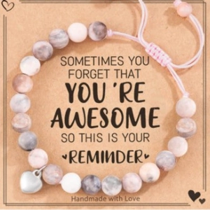 Adjustable handmade marbled beaded bracelet with silver heart charm on gift message card