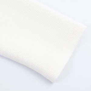 Macro shot of white ribbed knit fabric texture showing premium craftsmanship