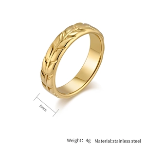 Detail of 5mm gold tulip flower ring in stainless steel with engraved leaf patterns