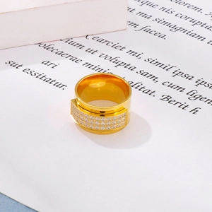 Detail of wide 18k gold plated stainless steel ring with multiple rows of sparkling CZ
