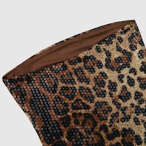 Close-up of leopard print fabric with shiny sequins and brown inner lining detail