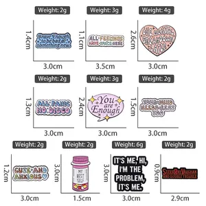 Variety set of cartoon metal enamel pins with motivational quotes and artistic designs