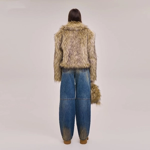 Back view of vintage blue wide-leg jeans paired with a textured brown faux fur jacket