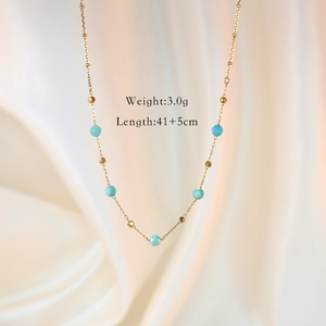Detail of gold necklace with blue faceted stones showing 41+5cm length and 3g weight