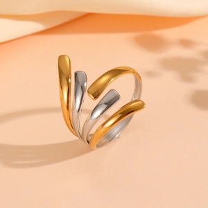 Detailed view of the sleek two-tone wave ring in gold and silver finish with open band
