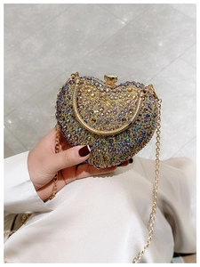 Detailed macro view of a heart-shaped evening bag featuring colorful pavé rhinestones