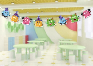 Close-up of colorful cartoon monster banner bunting with pumpkins and bats patterns