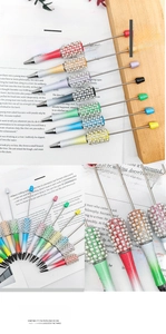 Macro detail of DIY beaded pen with gradient barrel, faux pearls, and sparkling rhinestones