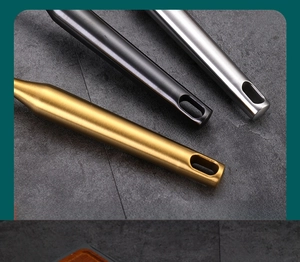 Detailed close-up of thick matte metal whisk handles with convenient hanging holes