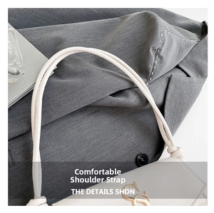 Detailed close-up of white crossbody bag with elegant knot strap and gold hardware