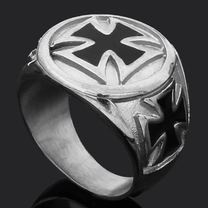 Detail of vintage silver and black Maltese Cross relief on men's titanium steel ring