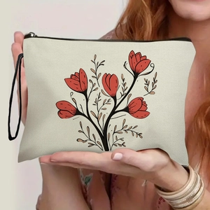 Canvas makeup bag with red tulip print and black zipper strap for travel organization