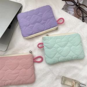 Quilted heart pattern mini cosmetic pouches in purple, mint green and pale pink colors