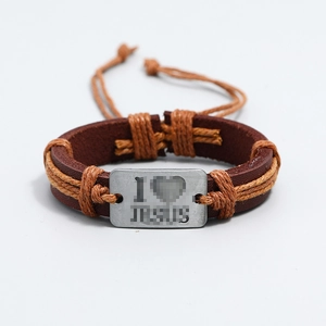Detail of adjustable brown woven leather bracelet with metal plate on white background