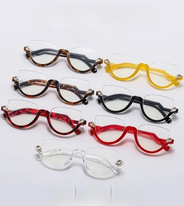 Detailed flat lay of semi-rimless cat-eye glasses in multiple colors with rhinestone accents