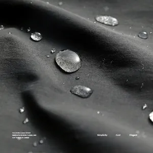 Waterproof dark grey apron fabric showing lotus effect water droplets on surface