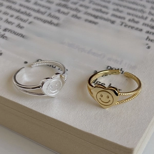 Adjustable sterling silver rings with heart-shaped smiley faces in gold and silver