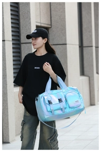 Detail of blue glossy waterproof sports bag with buckles and adjustable straps