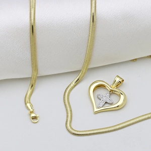 Two-tone heart pendant necklace with cross on white satin background