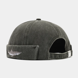 Washed charcoal grey brimless docker hat featuring shark embroidery and metal buckle