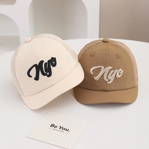 Detail of breathable mesh baseball caps for kids with Nyo embroidery and curved brim
