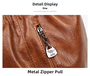 Close-up of premium brown leather bag featuring a custom JPDS kangaroo metal zipper pull