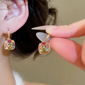 Elegant gold plated jewelry set with square colorful zircon stones on female model
