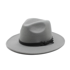 Detail of gray wool felt fedora featuring a black leather band with a stylish side knot