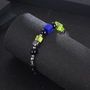 Detailed shot of retro titanium steel bracelet with colorful square beads and pearls