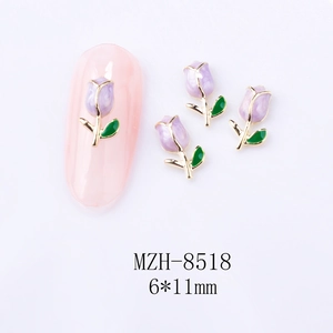Detailed macro view of a 6x11mm purple tulip nail charm with golden metal edges