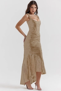 Detail of gold corset maxi dress showing the boning structure and jacquard silk texture