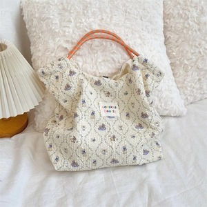 Detail of embossed bubble fabric canvas bag with cute rabbit pattern and sturdy rope handle