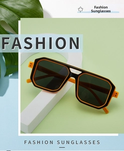 Detailed view of bicolor rectangular sunglasses with double bridge design on geometric blocks