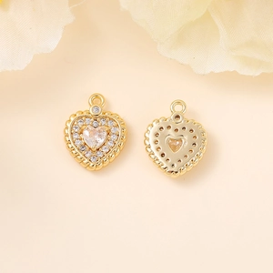 Front and back view of gold heart pendant with zircon stones for DIY jewelry making