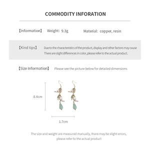 Detail view of lily-of-the-valley drop earrings with measurements 8.4cm length and 9.3g weight