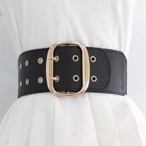 Elastic wide black waist belt with gold buckle and grommets on white dress