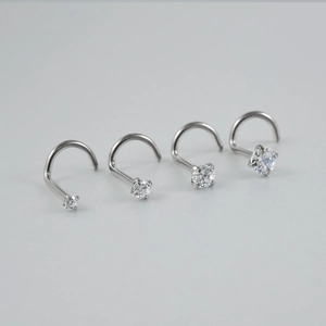 Set of four G23 titanium nose studs with clear round zircon in graduated sizes