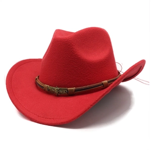 Detailed top view of red cowboy hat with braided cord and bronze skull emblem detail