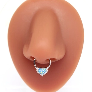 Silver nose hoop with blue heart opal pendant shown on a model nose for professional look