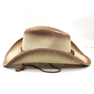 Detail of western straw cowboy hat featuring gradient weave and studded leather band