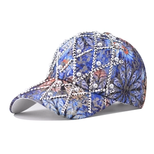 Floral baseball cap with pearls and rhinestones decoration in a navy blue pattern