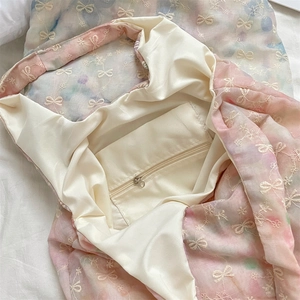 Detailed interior view of pink tie-dye tote bag with silk lining and zipper pocket
