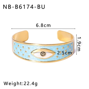 Detailed view of evil eye enamel cuff bangle with dimensions 6.8cm and gold star patterns