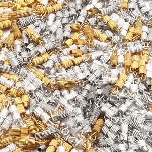 Macro shot of vertical striped screw clasps in gold and silver for DIY jewelry making
