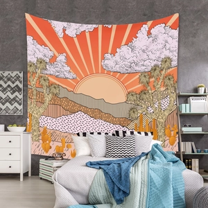 Bohemian tapestry featuring a desert sunrise illustration hung as bedroom wall decor