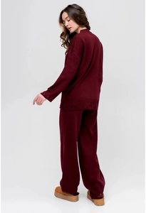 Detail view of the wine red knit set showing the round neck top and wide leg pants