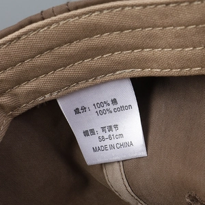 Detail of adjustable cotton baseball cap inner lining with size label and fine stitching