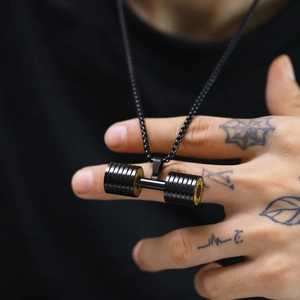 Men's titanium steel dumbbell necklace with black fitness barbell pendant on a male model