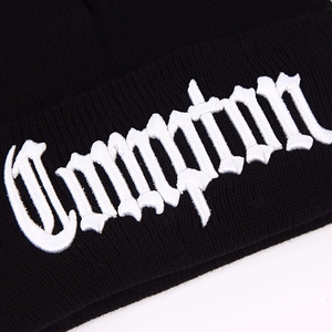 Black knit beanie featuring white Compton 3D embroidery in Old English font style