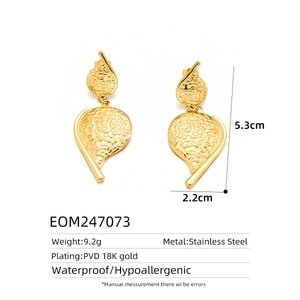 Detailed view of 18K gold plated steel leaf earrings with 5.3cm height dimensions